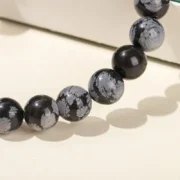 JD-4-12MM-Natural-Stone-Snowflake-Stone-Beads-Elastic-Bracelet-Grey-Black-Color-Smooth-Round-Beads-1.webp